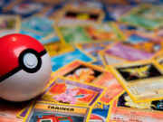 Peachstate Hobby Distribution Buys Out UK Counterpart Bliss A pokemon ball lying on a pile of trading pokemon cards.