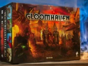 Best Dungeon Crawler Board Games Gloomhaven box preview and cool background.